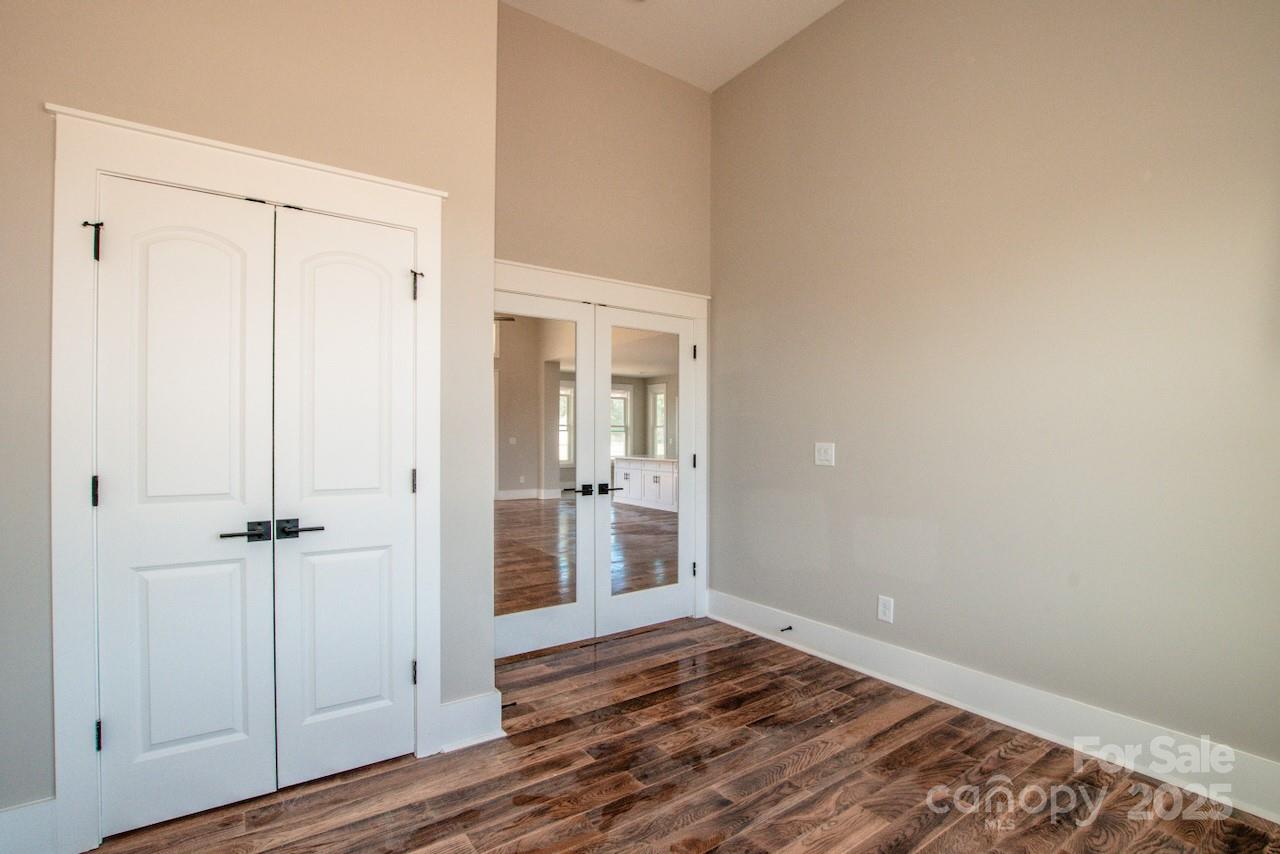 6098 Ballard Road Denver, NC 28037 - Photo 29 of 48 an empty room with wooden floor and closet