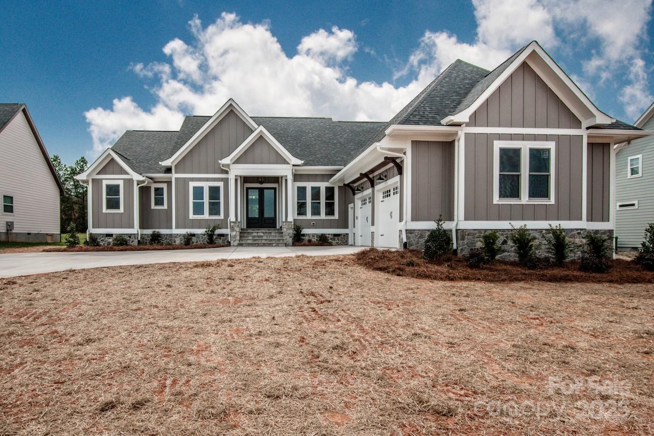6098 Ballard Road Denver, NC 28037 - Photo 5 of 48 a front view of a house with a yard