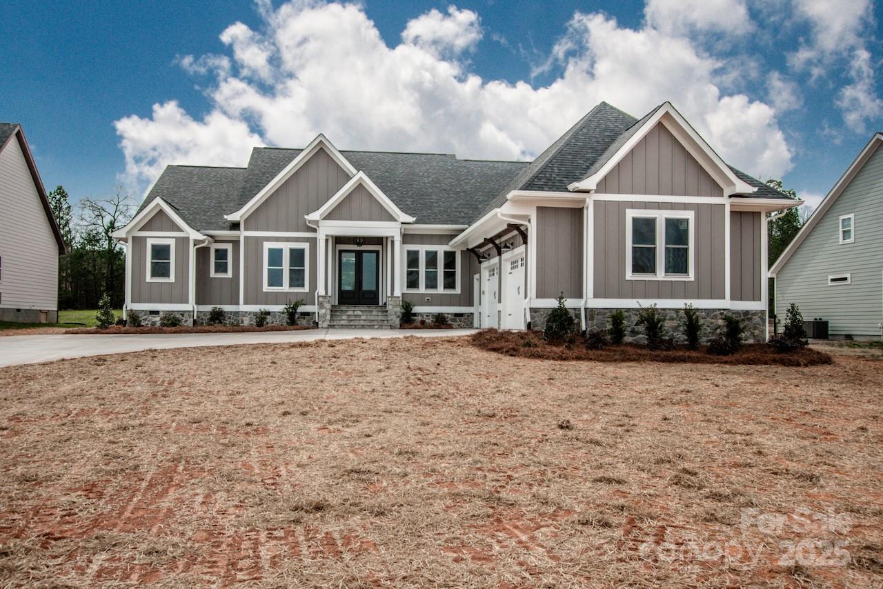 6098 Ballard Road Denver, NC 28037 - Photo 6 of 48 a front view of a house with a yard