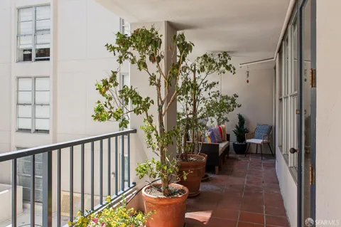 a view of a balcony with a roof deck