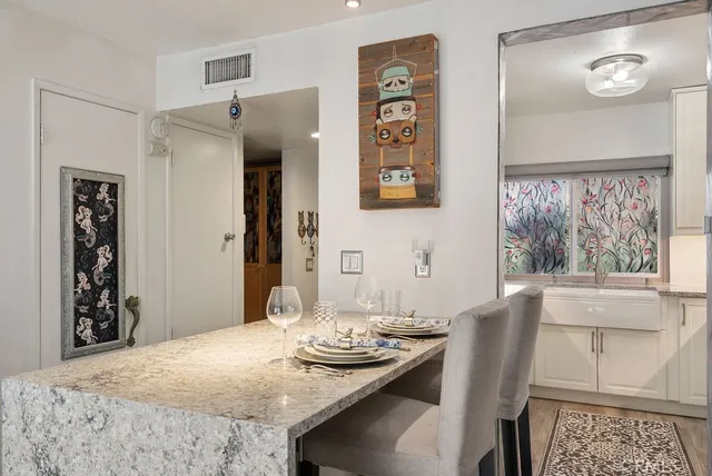a view of a dining room with furniture and window