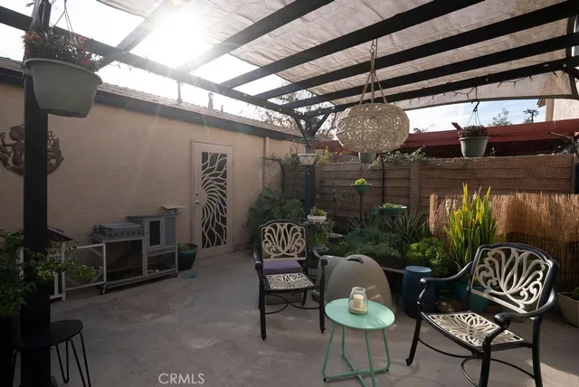 a outdoor living space with furniture and a rug