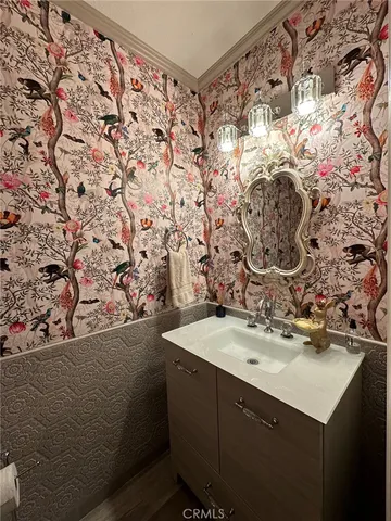 a bathroom with a sink and mirror