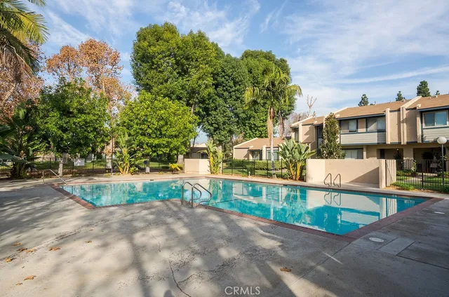 a view of a street with houses on both side