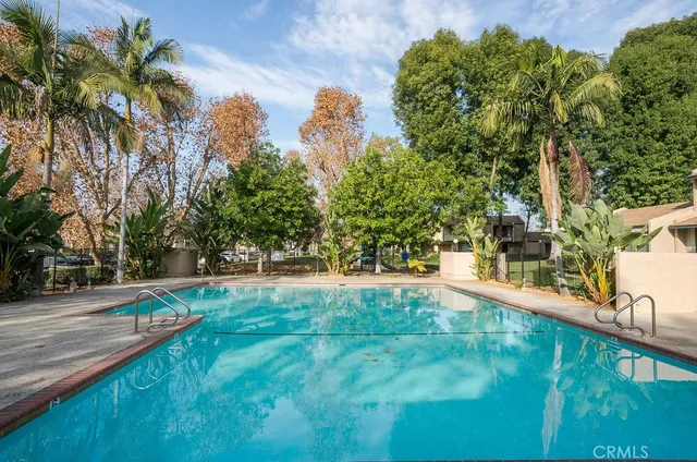 a view of swimming pool with a yard