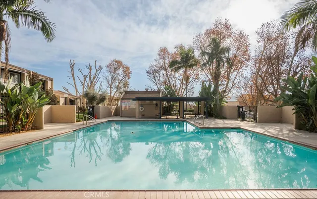 a view of a house with backyard porch and sitting area