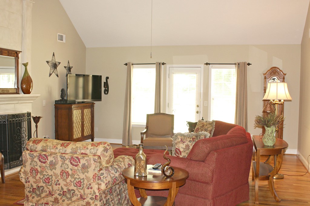 1397 Jenkins Road, Unit 2 Forsyth, GA 31029 - Photo 3 of 11 a living room with furniture fireplace and flat screen tv