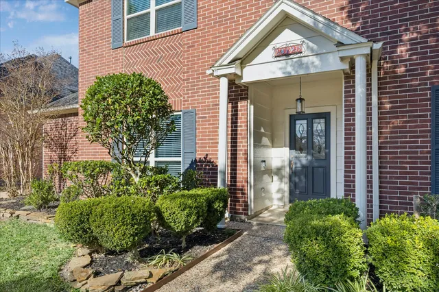 front view of a house with a small yard