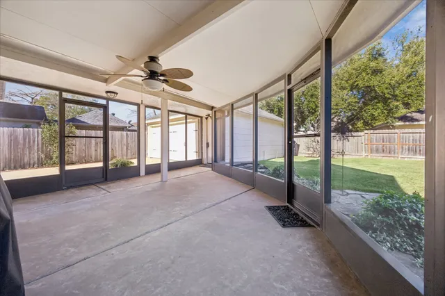 a view of an empty room with windows