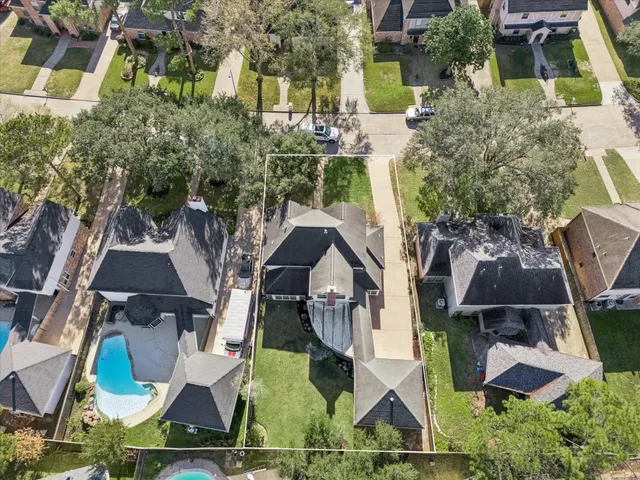 an aerial view of house with yard