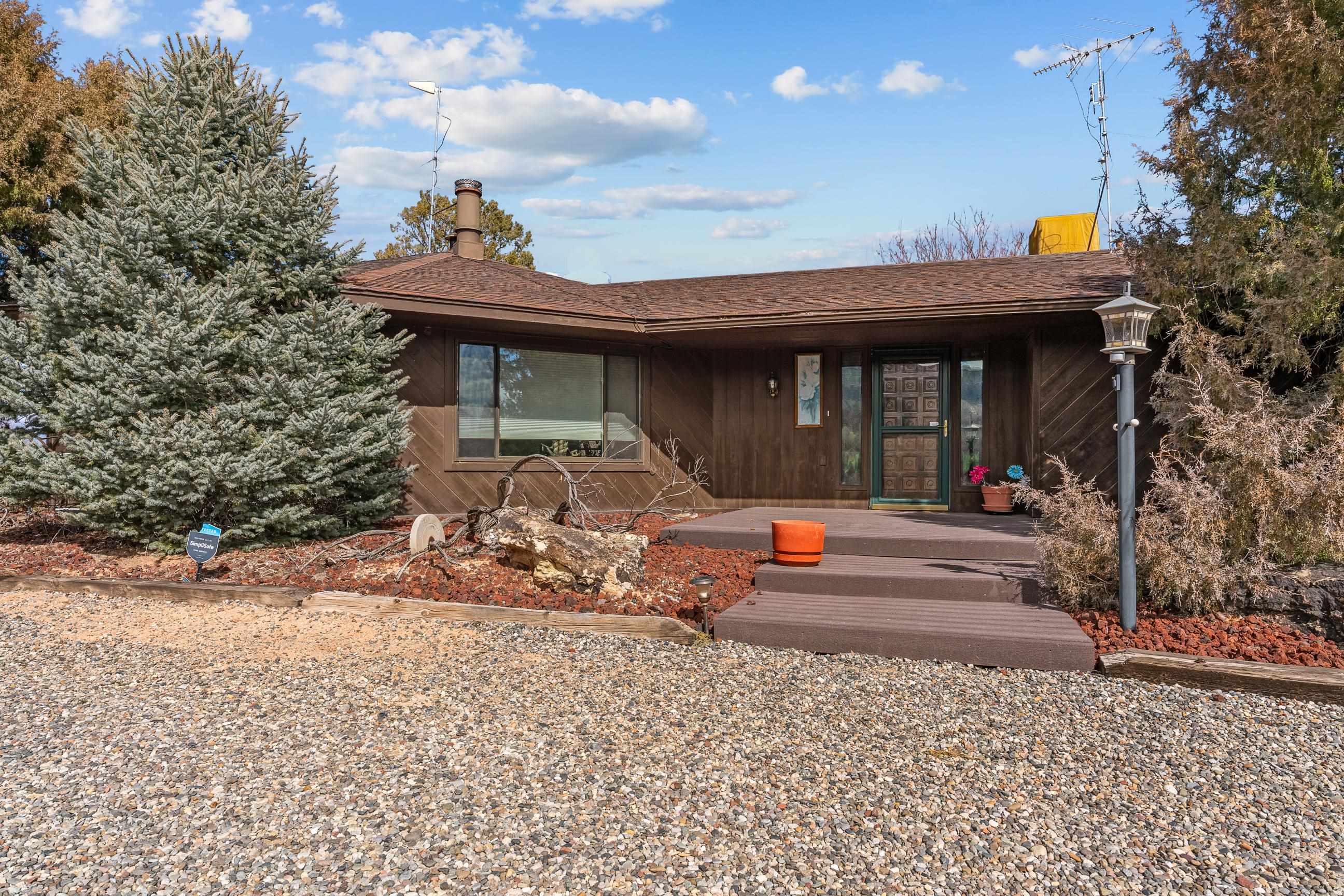 2108 Desert Hill Road Grand Junction, CO 81507 - Photo 11 of 29 a view of a chairs and tables in patio of the house