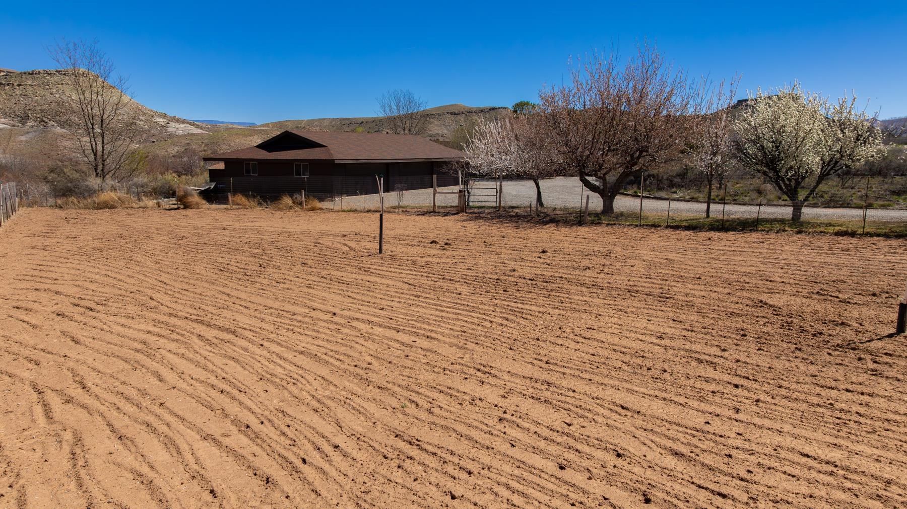 2108 Desert Hill Road Grand Junction, CO 81507 - Photo 18 of 29 a view of a terrace with a bench
