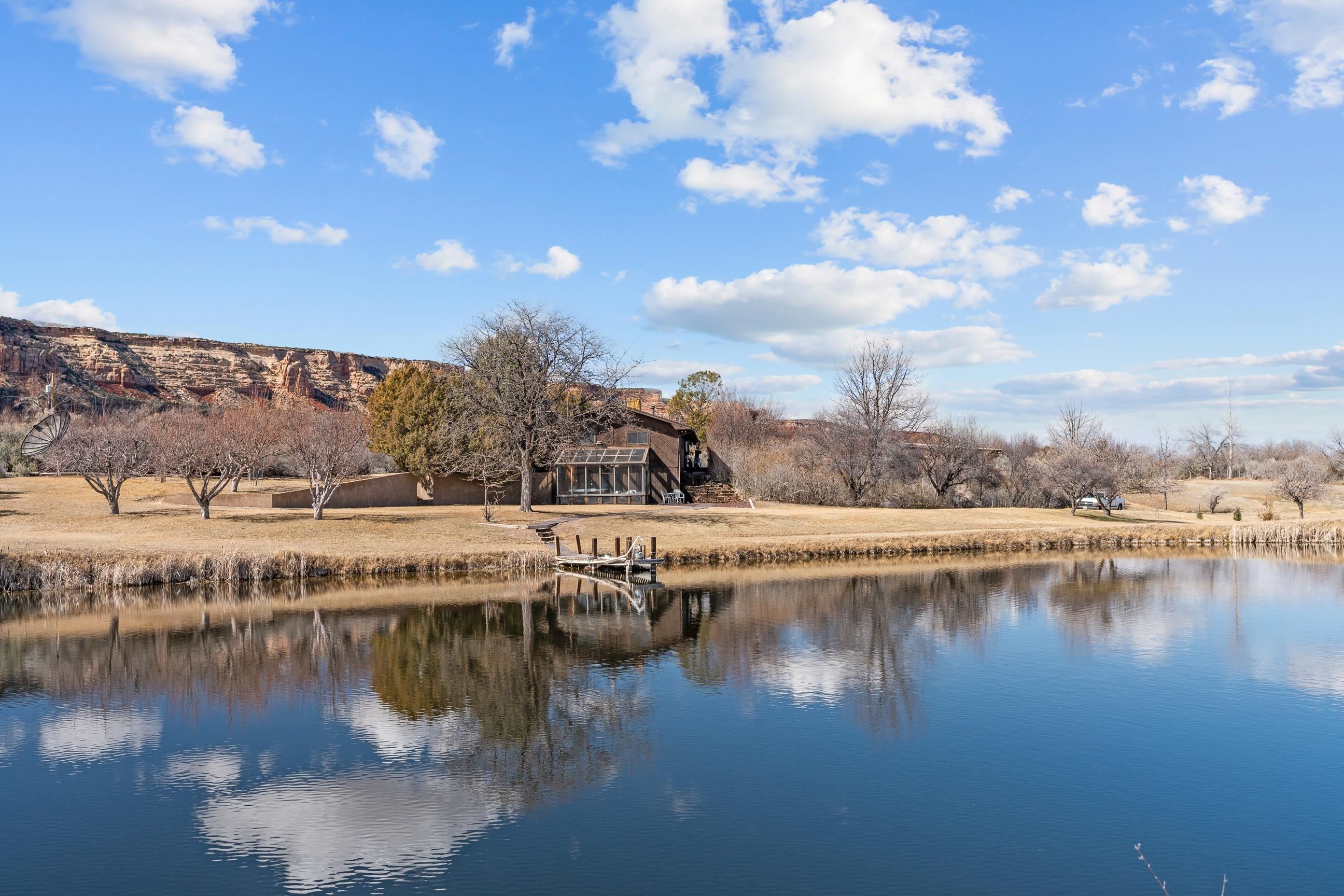 2108 Desert Hill Road Grand Junction, CO 81507 - Photo 24 of 29 a view of residential houses with outdoor space and lake view