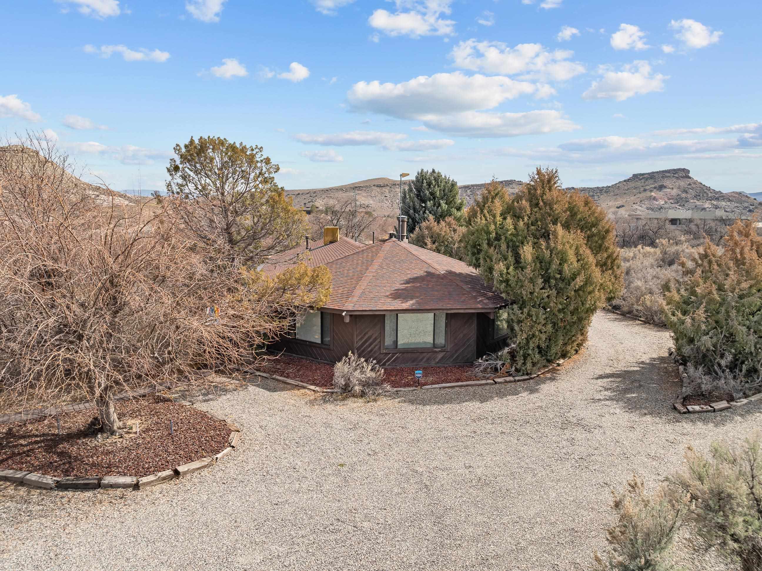 2108 Desert Hill Road Grand Junction, CO 81507 - Photo 10 of 29 a front view of a house with a yard