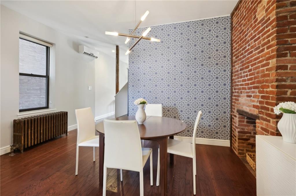5259 Carnegie Street Lawrenceville, PA 15201 - Photo 12 of 50 a view of a dining room with furniture and wooden floor