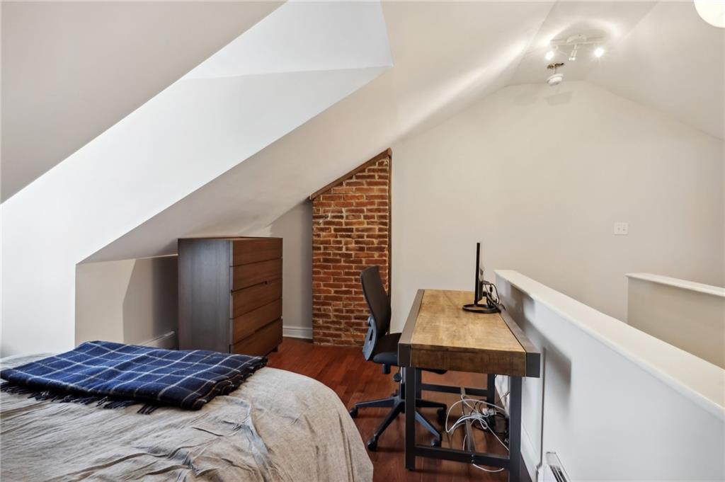 5259 Carnegie Street Lawrenceville, PA 15201 - Photo 21 of 50 a bedroom with a bed and a table in it