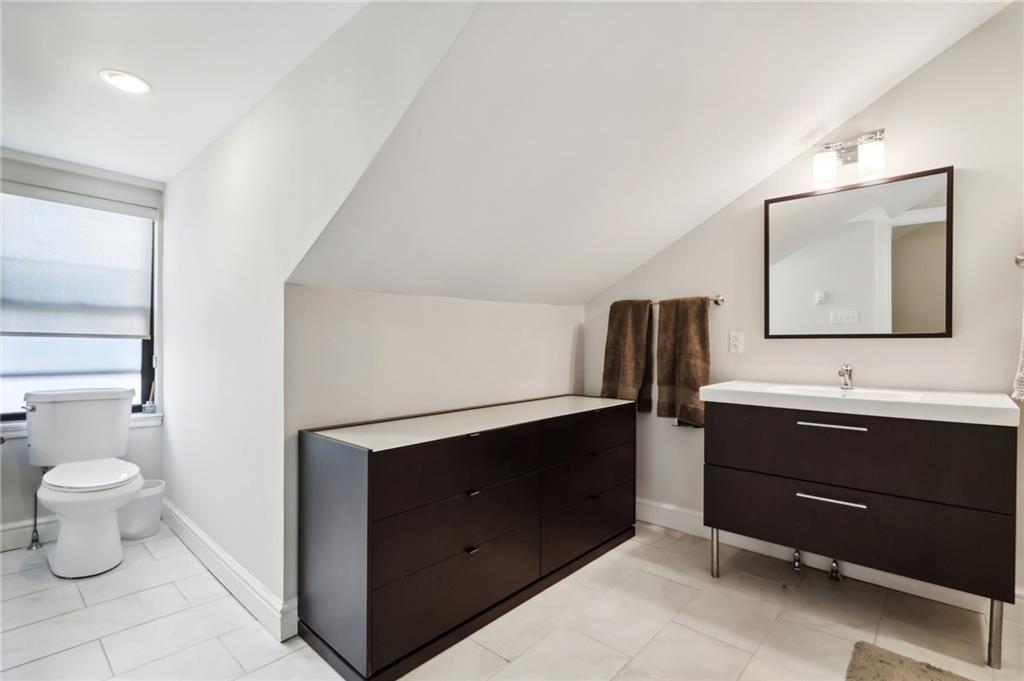 5259 Carnegie Street Lawrenceville, PA 15201 - Photo 22 of 50 a bathroom with a sink toilet and mirror