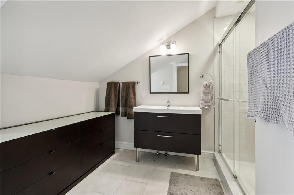 5259 Carnegie Street Lawrenceville, PA 15201 - Photo 23 of 50 a bathroom with a sink and a mirror