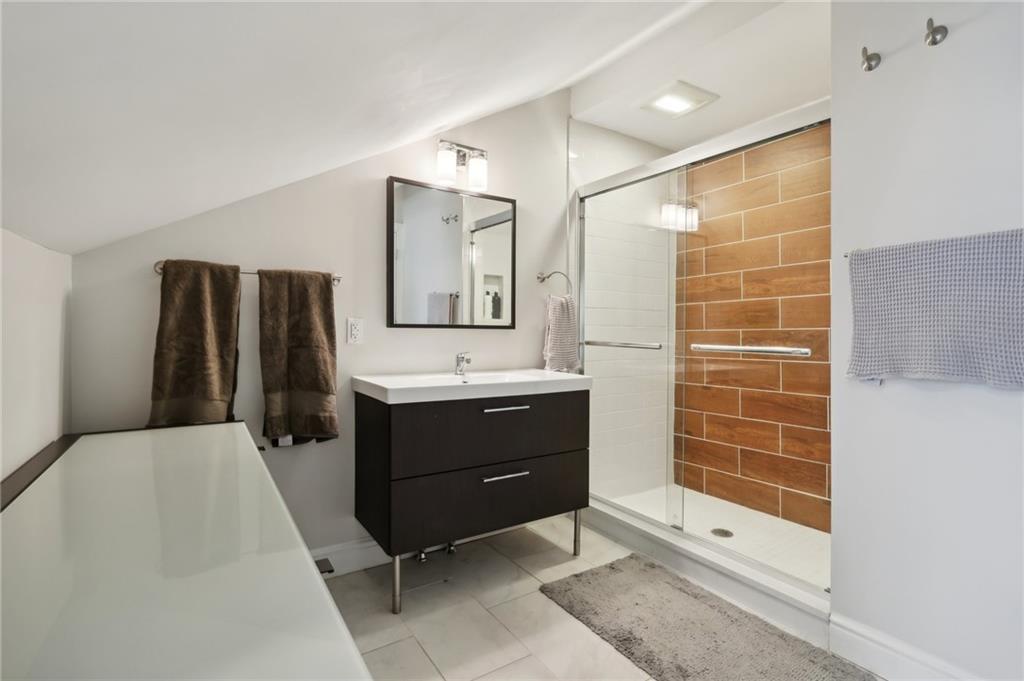 5259 Carnegie Street Lawrenceville, PA 15201 - Photo 24 of 50 a bathroom with a sink and a mirror