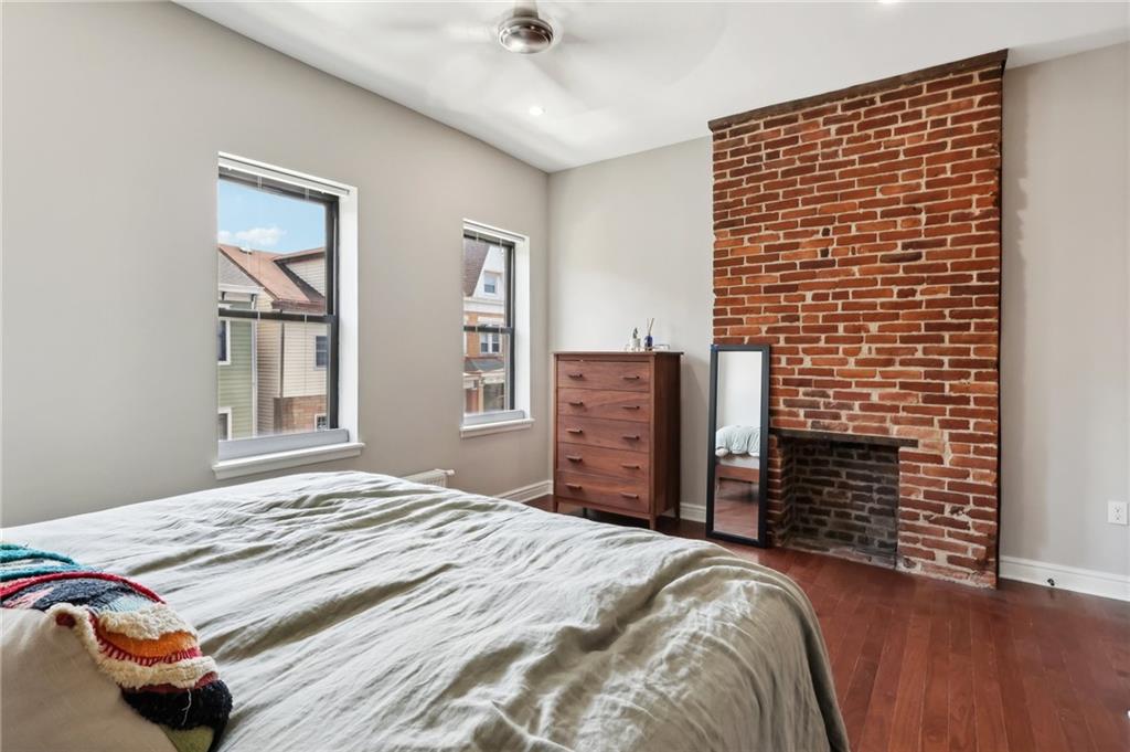 5259 Carnegie Street Lawrenceville, PA 15201 - Photo 35 of 50 a bedroom with a bed and a dresser