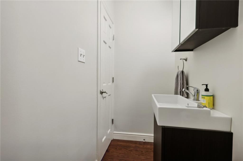 5259 Carnegie Street Lawrenceville, PA 15201 - Photo 37 of 50 a bathroom with a sink and a mirror