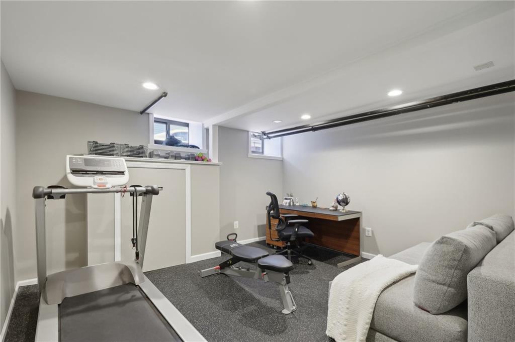 5259 Carnegie Street Lawrenceville, PA 15201 - Photo 39 of 50 a room with furniture a air conditioner and a window