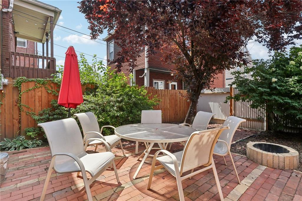 5259 Carnegie Street Lawrenceville, PA 15201 - Photo 41 of 50 a patio with a yard table and chairs