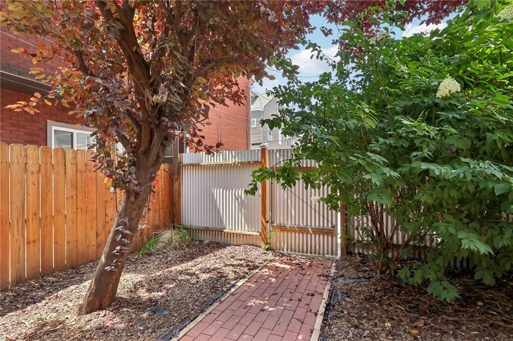 5259 Carnegie Street Lawrenceville, PA 15201 - Photo 43 of 50 a tree in front of a white house