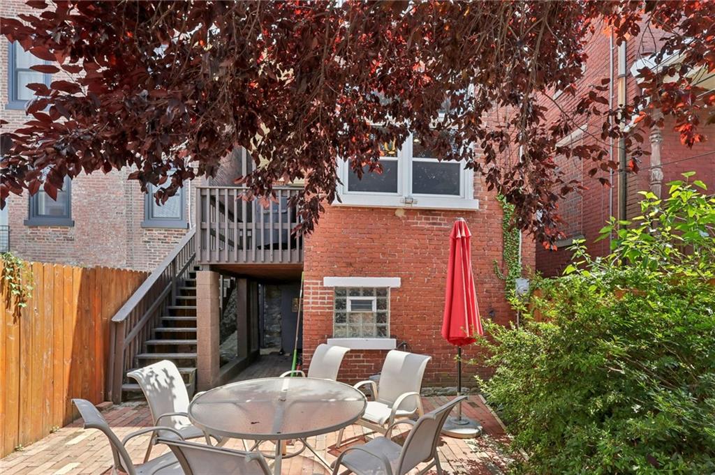 5259 Carnegie Street Lawrenceville, PA 15201 - Photo 45 of 50 a backyard of a house with table and chairs