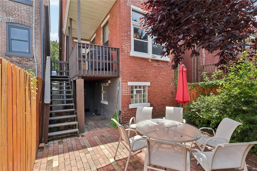 5259 Carnegie Street Lawrenceville, PA 15201 - Photo 46 of 50 a view of a patio with couches table and chairs and potted plants