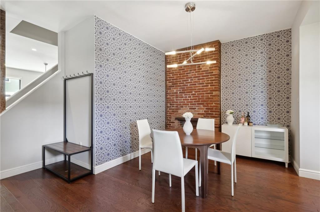 5259 Carnegie Street Lawrenceville, PA 15201 - Photo 10 of 50 a dining room with furniture and wooden floor