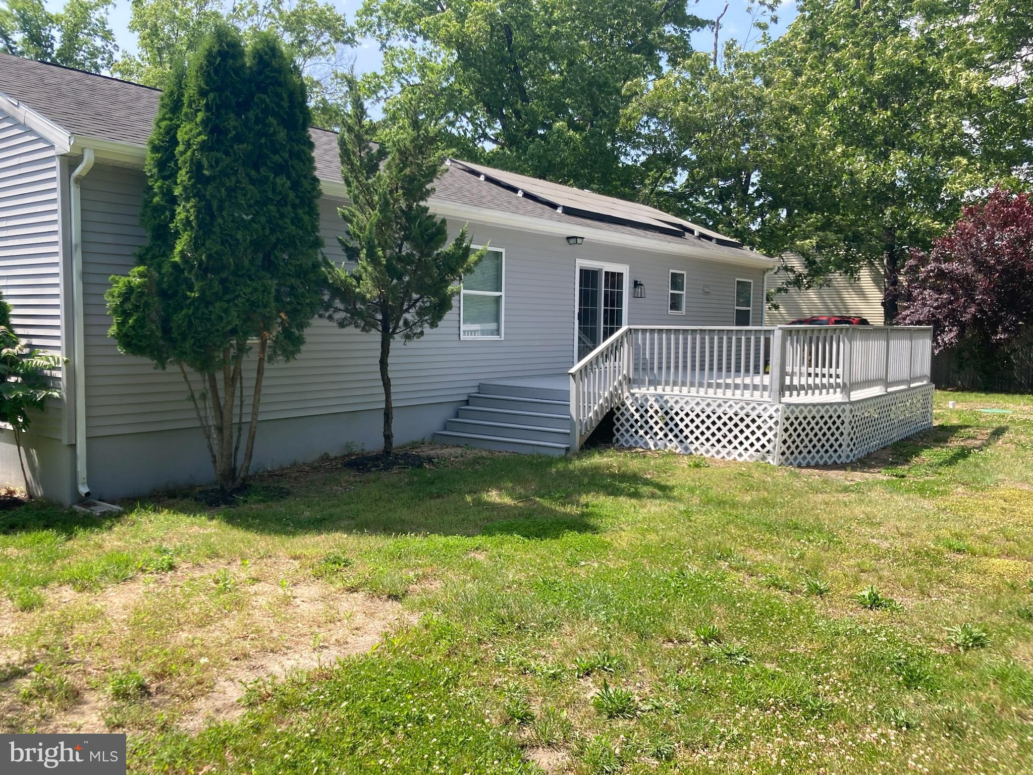 9 King Drive Bridgeton, NJ 08302 - Photo 5 of 16 a front view of a house with a yard