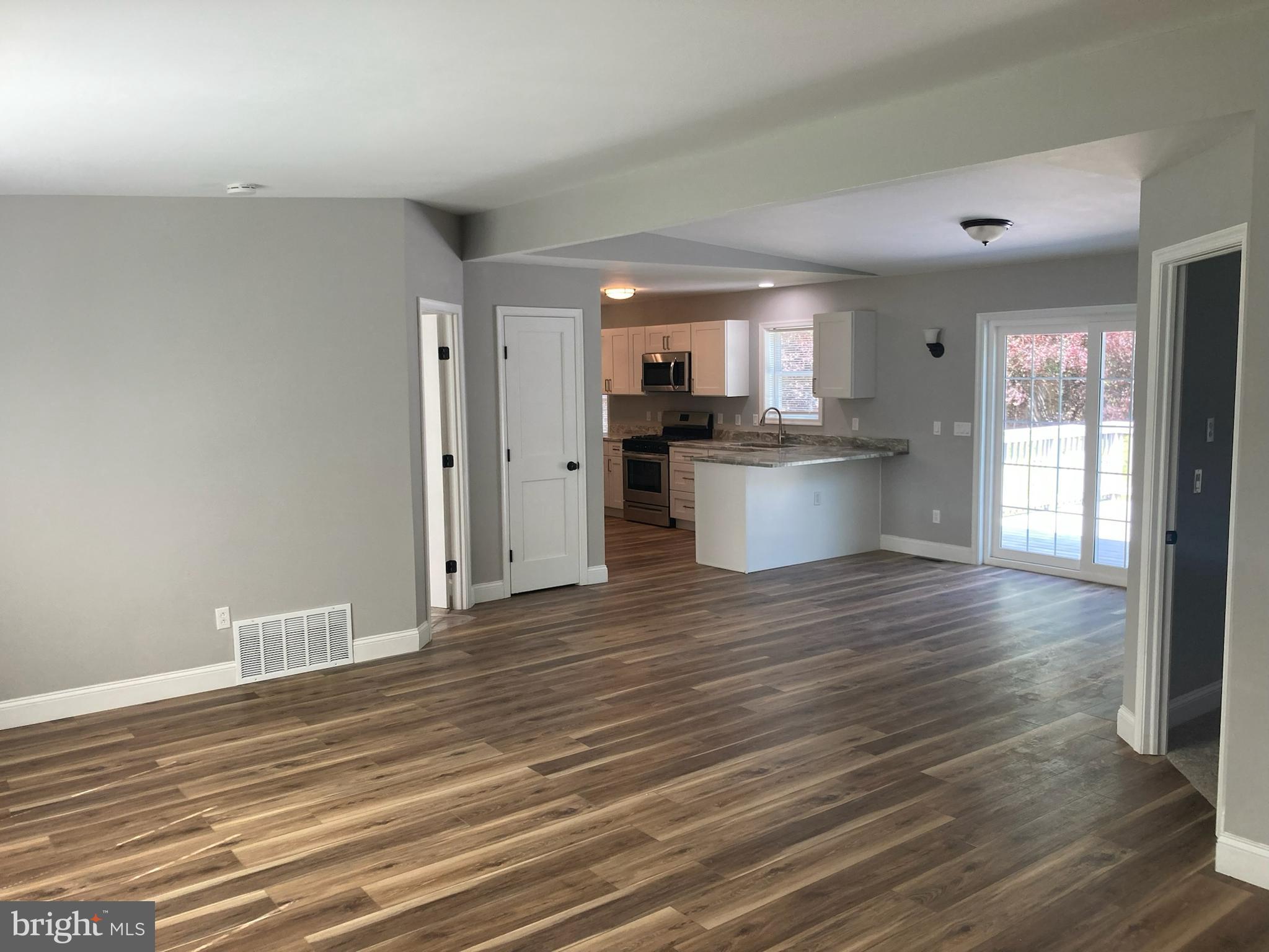 9 King Drive Bridgeton, NJ 08302 - Photo 6 of 16 a view of a kitchen with stove and wooden floor