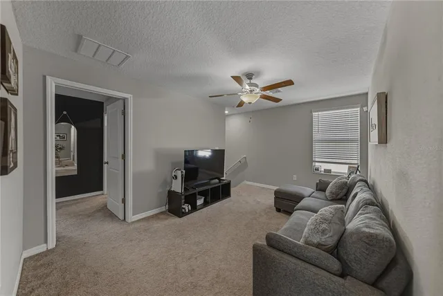 a white toilet sitting next to a shower curtain