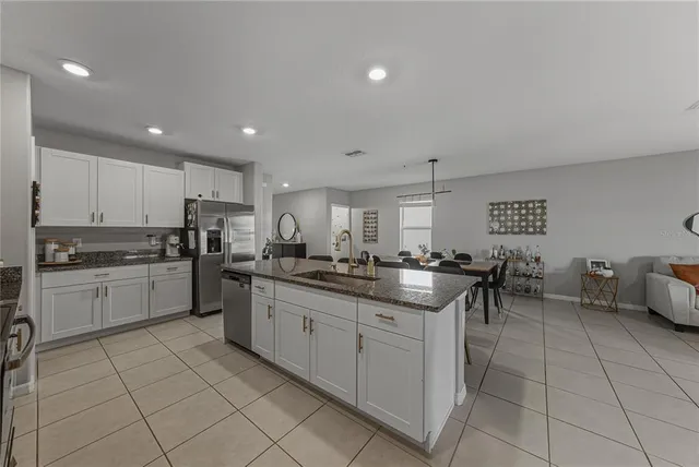 a large kitchen with granite countertop lots of counter top space