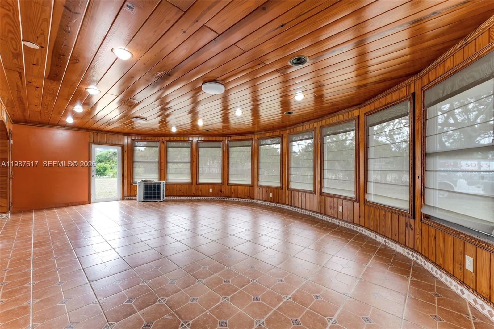 9840 Southwest 60th Street Miami, FL 33173 - Photo 14 of 37 a view of an empty room with windows