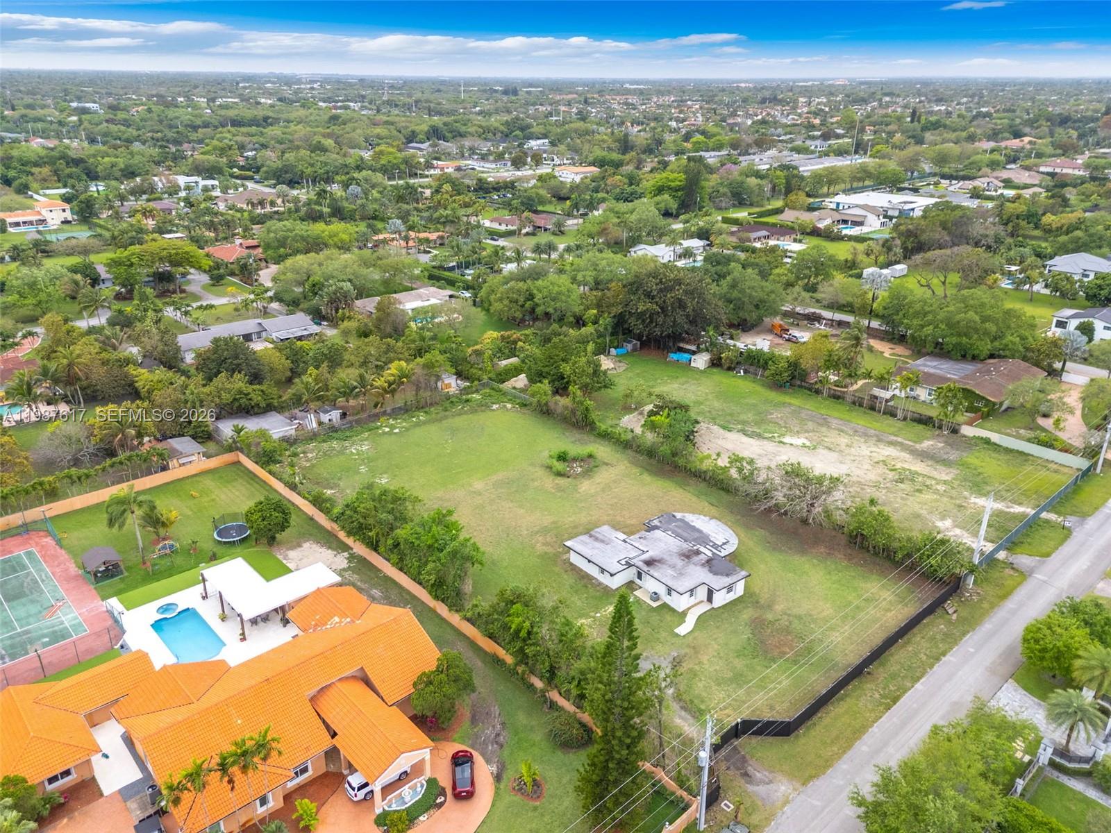 9840 Southwest 60th Street Miami, FL 33173 - Photo 2 of 37 an aerial view of residential houses with outdoor space