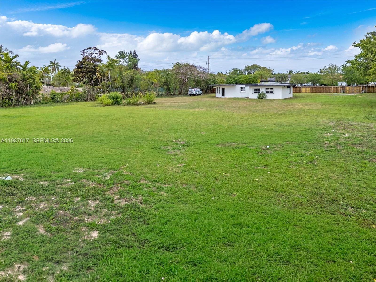 9840 Southwest 60th Street Miami, FL 33173 - Photo 27 of 37 a view of a field with an ocean