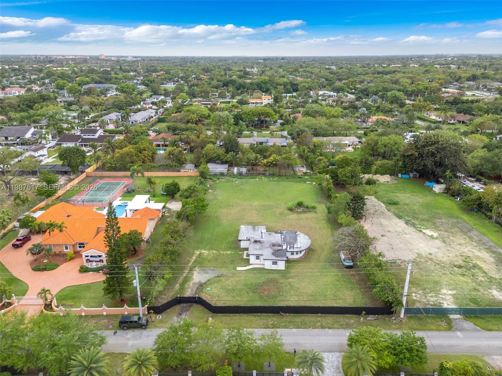 9840 Southwest 60th Street Miami, FL 33173 - Photo 29 of 37 an aerial view of residential houses with outdoor space and river