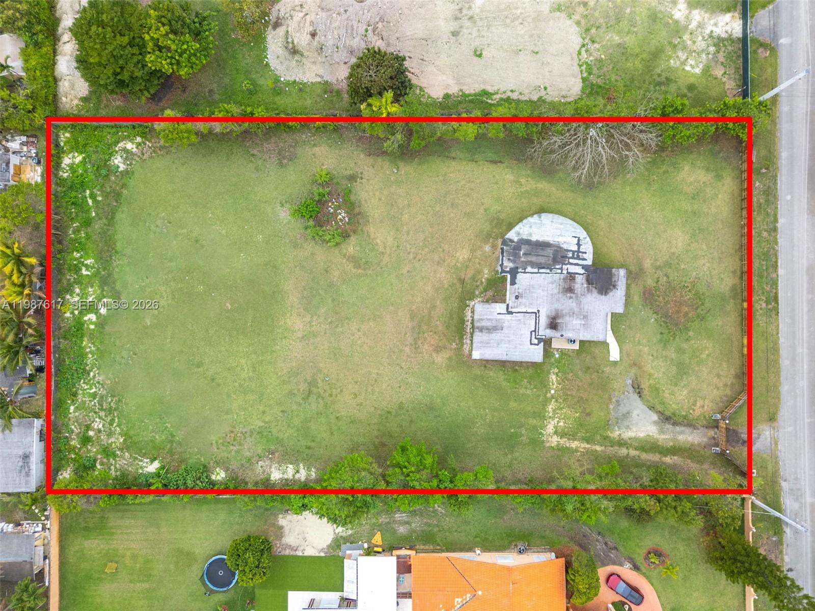 9840 Southwest 60th Street Miami, FL 33173 - Photo 3 of 37 a view of a lake and trees