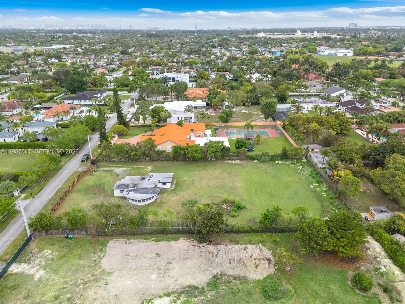 9840 Southwest 60th Street Miami, FL 33173 - Photo 33 of 37 an aerial view of residential houses with outdoor space and river