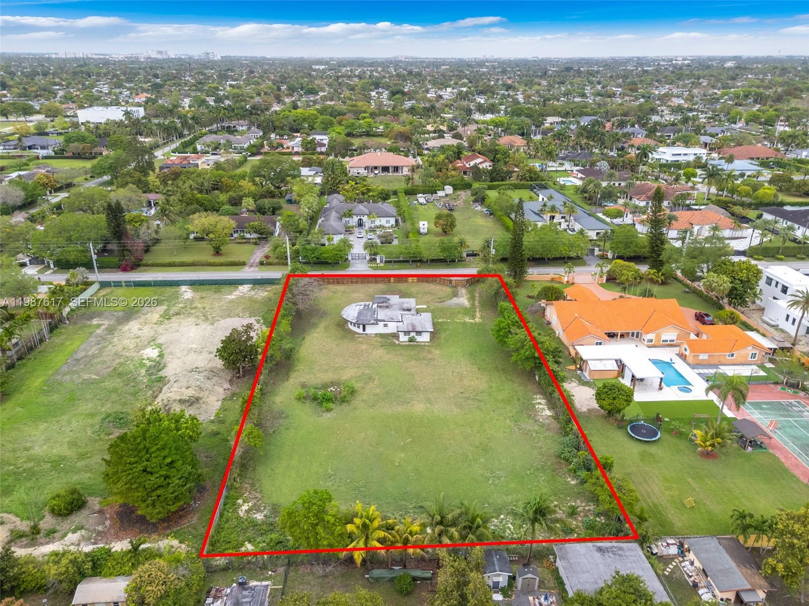 9840 Southwest 60th Street Miami, FL 33173 - Photo 34 of 37 an aerial view of residential houses with outdoor space