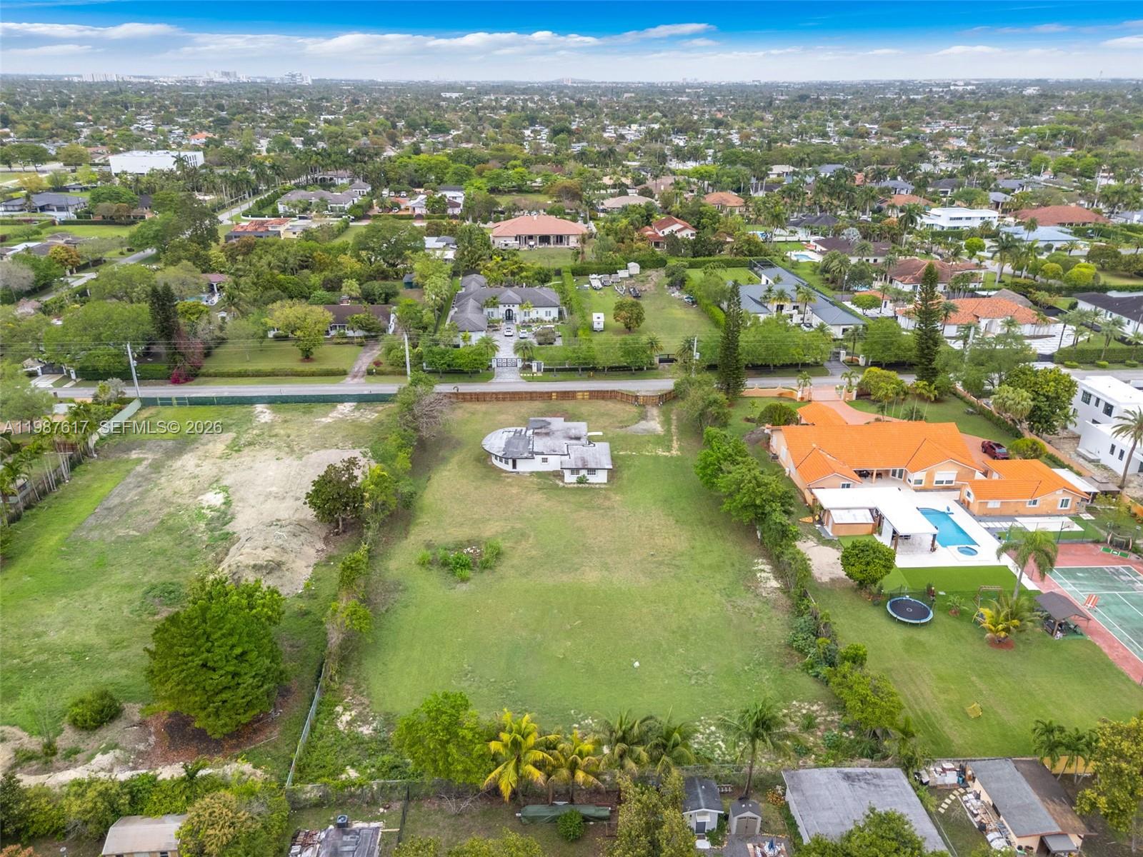 9840 Southwest 60th Street Miami, FL 33173 - Photo 35 of 37 an aerial view of residential houses with outdoor space
