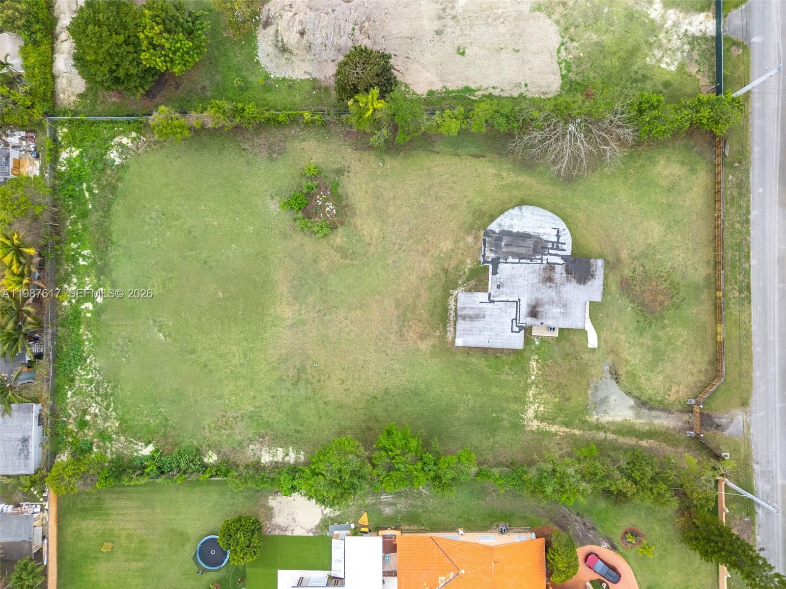 9840 Southwest 60th Street Miami, FL 33173 - Photo 4 of 37 an aerial view of lake residential house with outdoor space and trees around