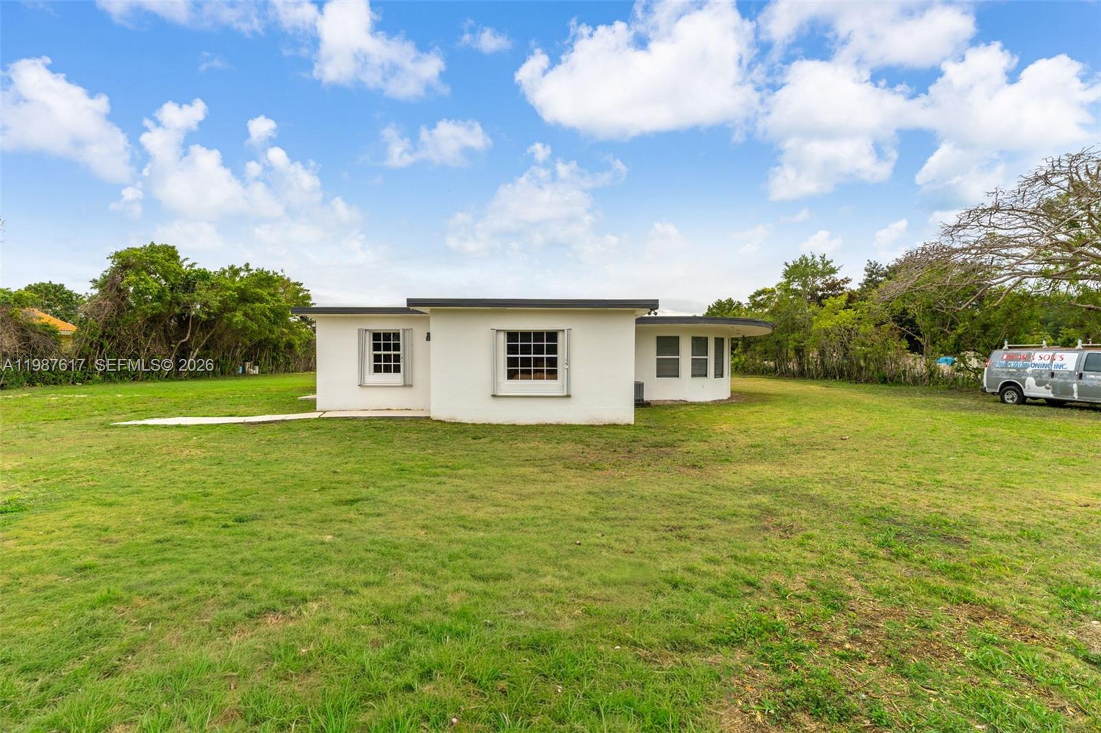 9840 Southwest 60th Street Miami, FL 33173 - Photo 5 of 37 a view of a house with a big yard
