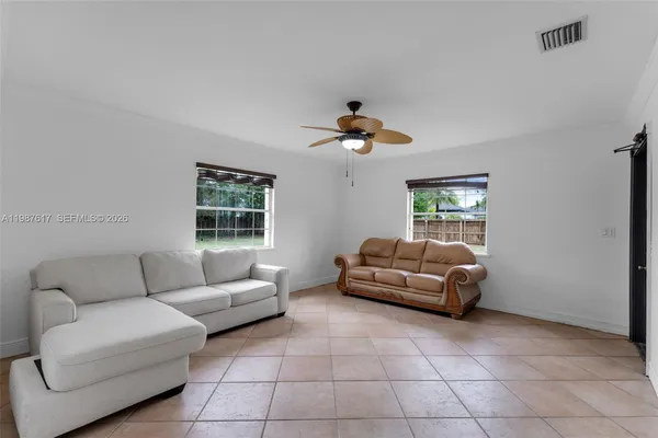 a living room with furniture and a window