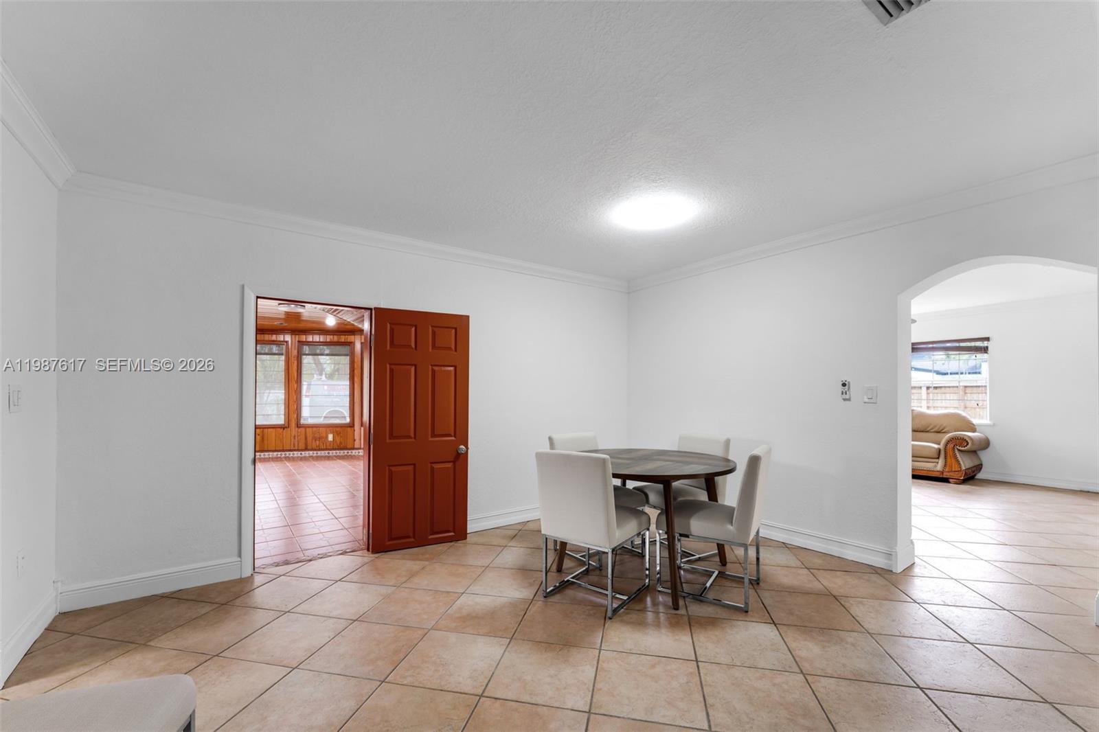 9840 Southwest 60th Street Miami, FL 33173 - Photo 9 of 37 a view of a livingroom with furniture and an entryway