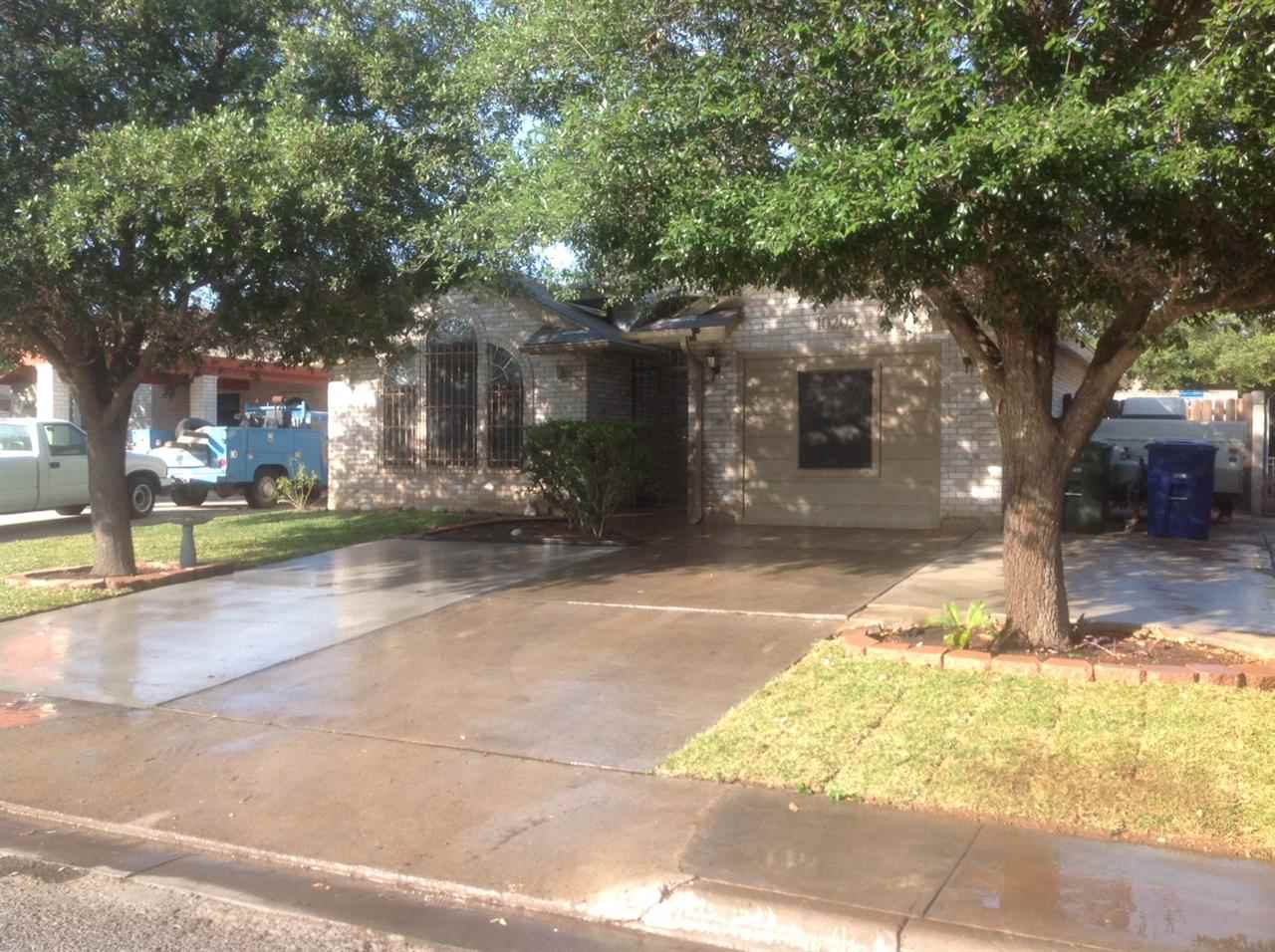 10203 Center Road Laredo, TX 78045 - Photo 1 of 9 a view of a yard with plants and trees