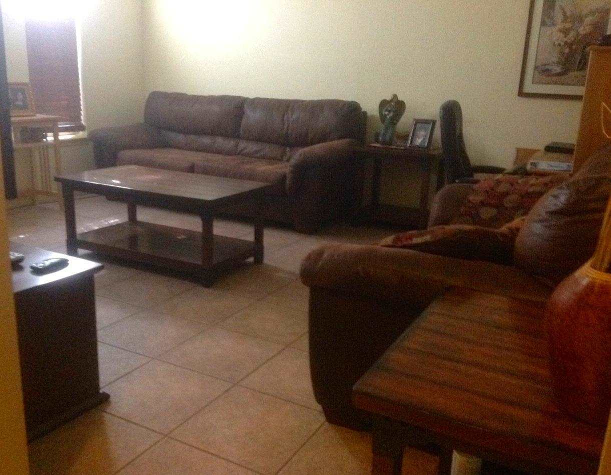 10203 Center Road Laredo, TX 78045 - Photo 5 of 9 a living room with furniture and a couch