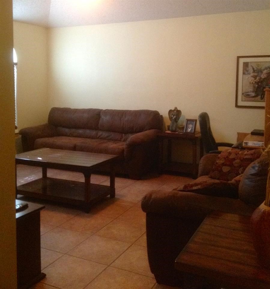 10203 Center Road Laredo, TX 78045 - Photo 6 of 9 a living room with furniture and a window